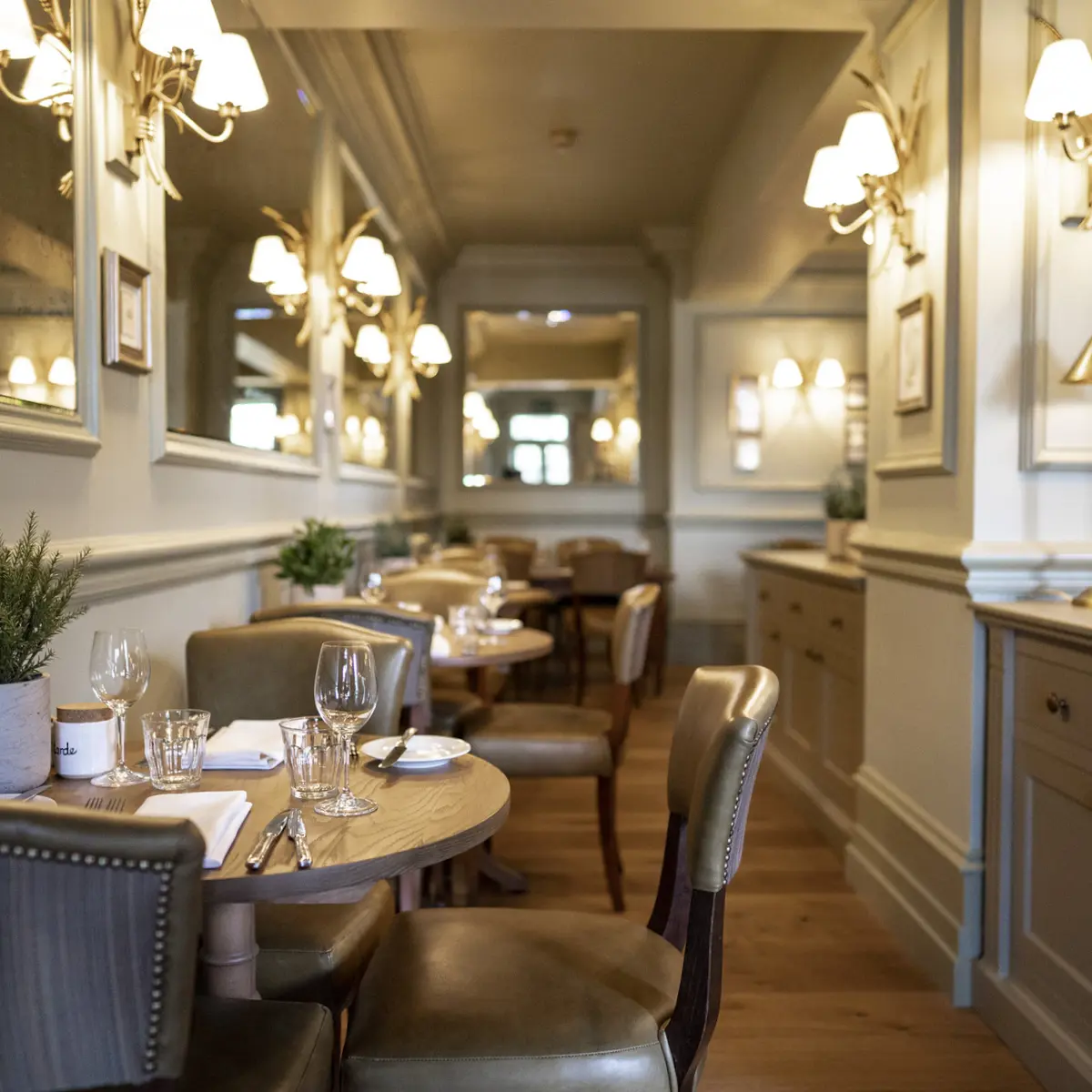 A spacious dining room filled with numerous tables and chairs.
