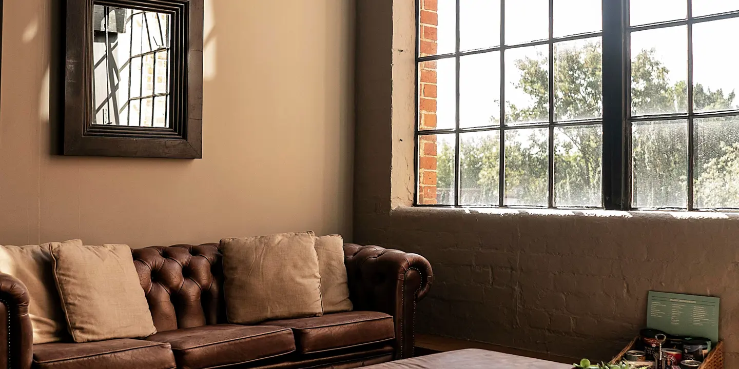 An elegantly furnished living room featuring a comfortable couch and a stylish coffee table.