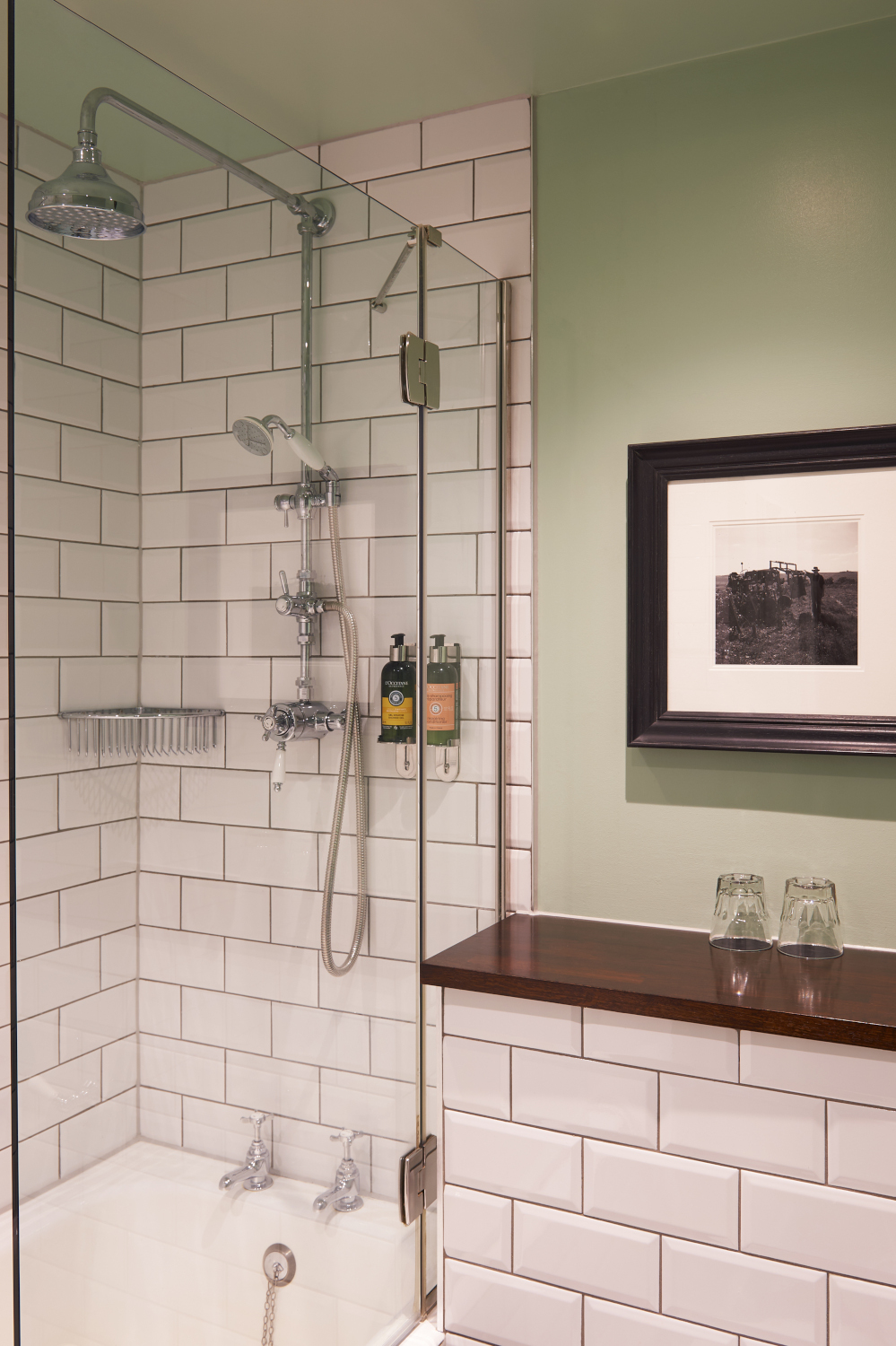 A bathroom featuring shower over bath