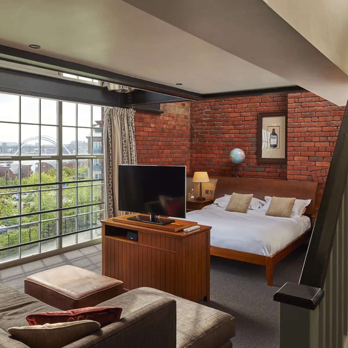 Bedroom featuring a comfortable bed and television.