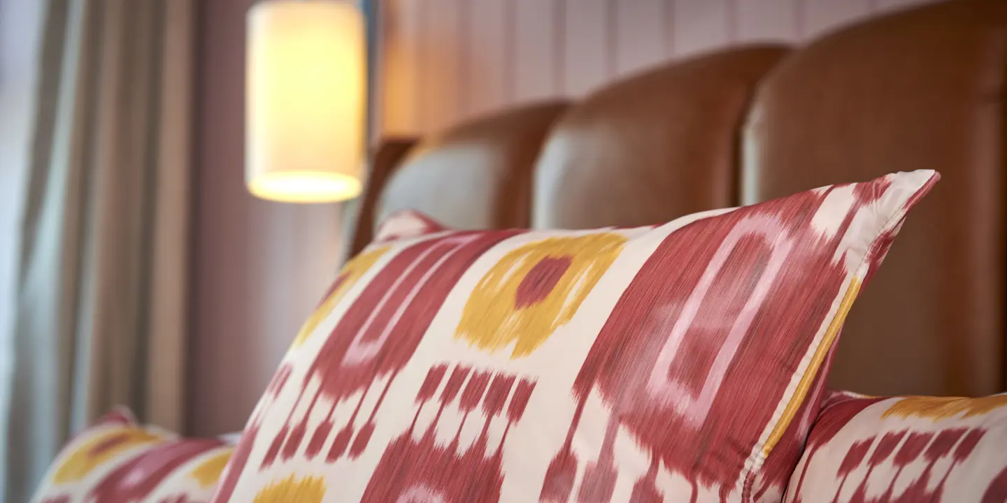 Close-up of a pillow on a bed.