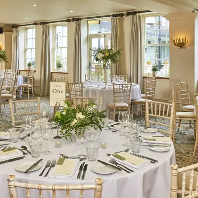 Dining room featuring a prominent wall painting.