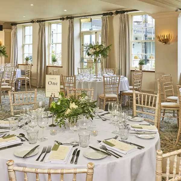 Dining room featuring a prominent wall painting.