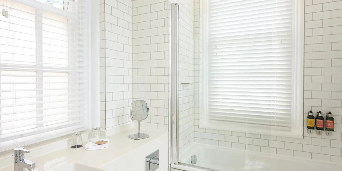 A bathroom featuring a sink, toilet, and bathtub.