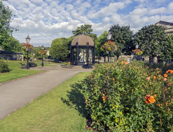 A gazebo situated amidst a verdant park.
