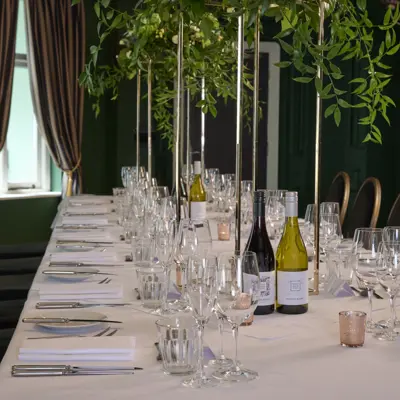 Table set for a wedding breakfast with candles.