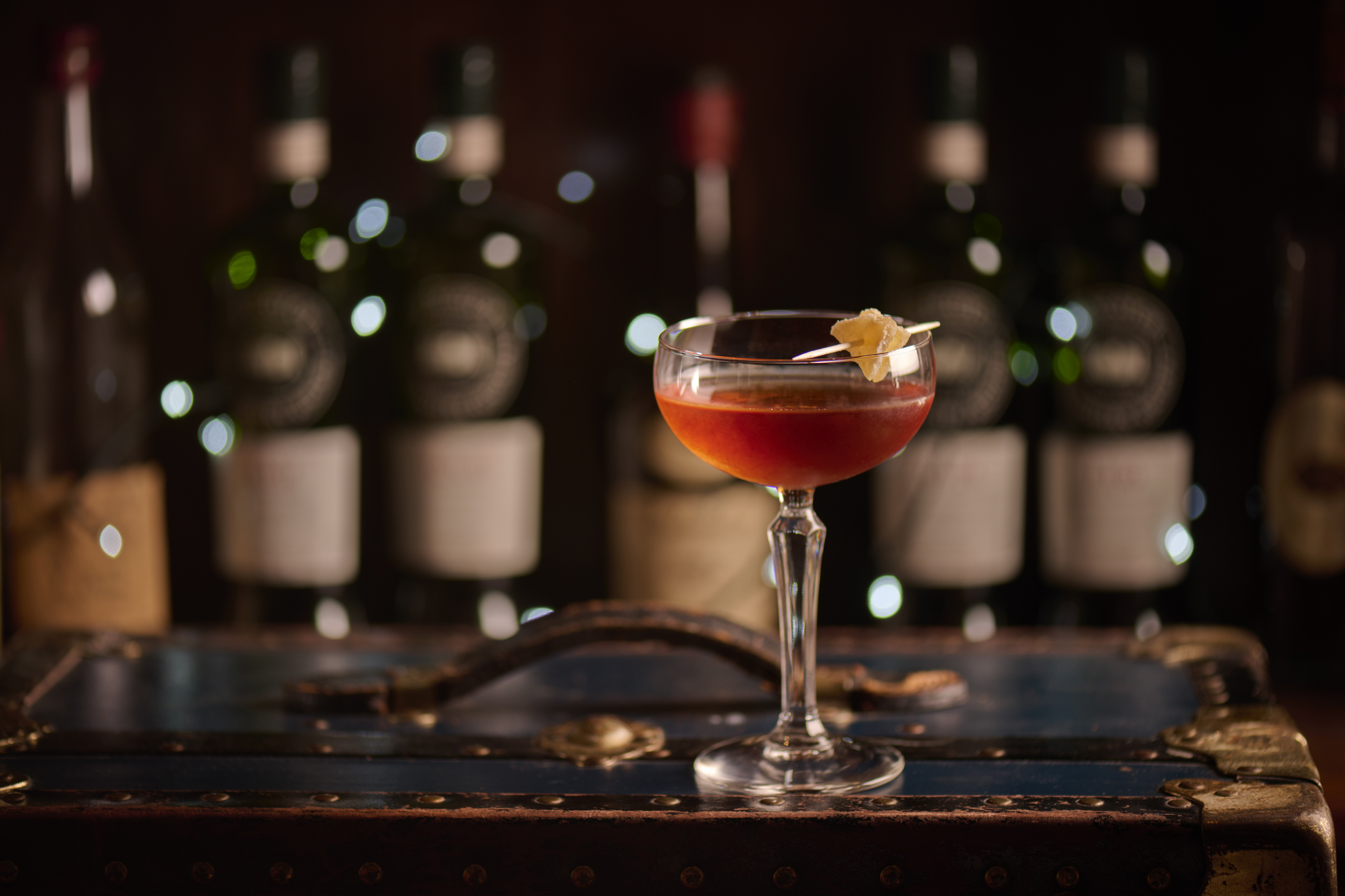 A Christmas cocktail on top of a briefcase