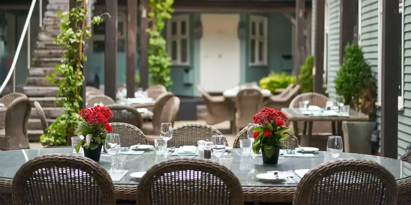 Tables adorned with vases filled with flowers.