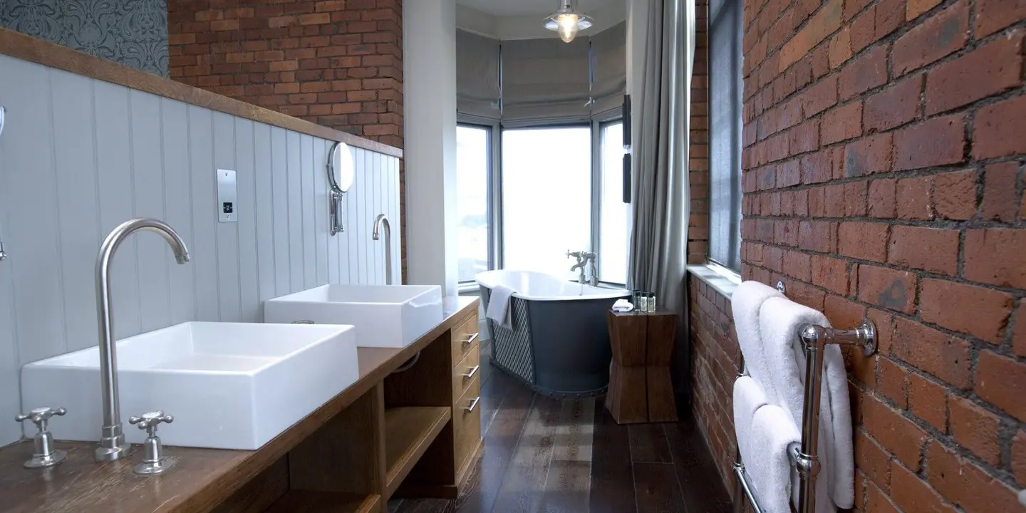 Bathroom featuring two sinks and a bathtub