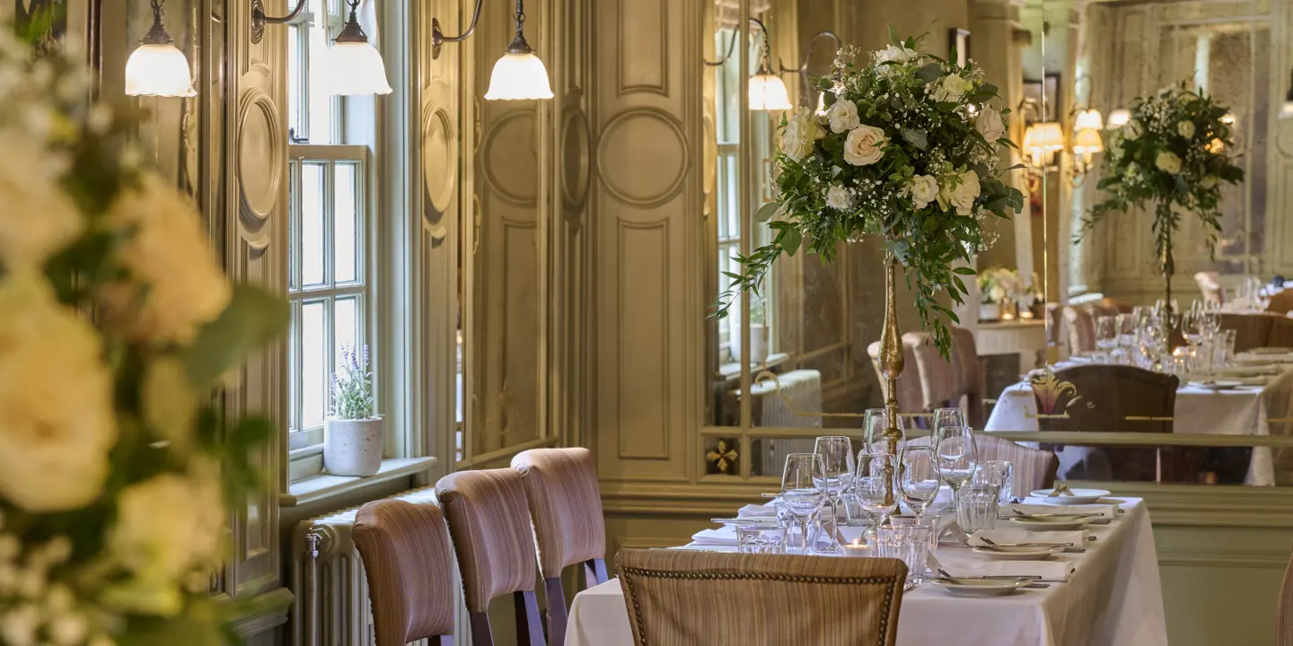 A beautifully arranged dining table with elegant place settings.