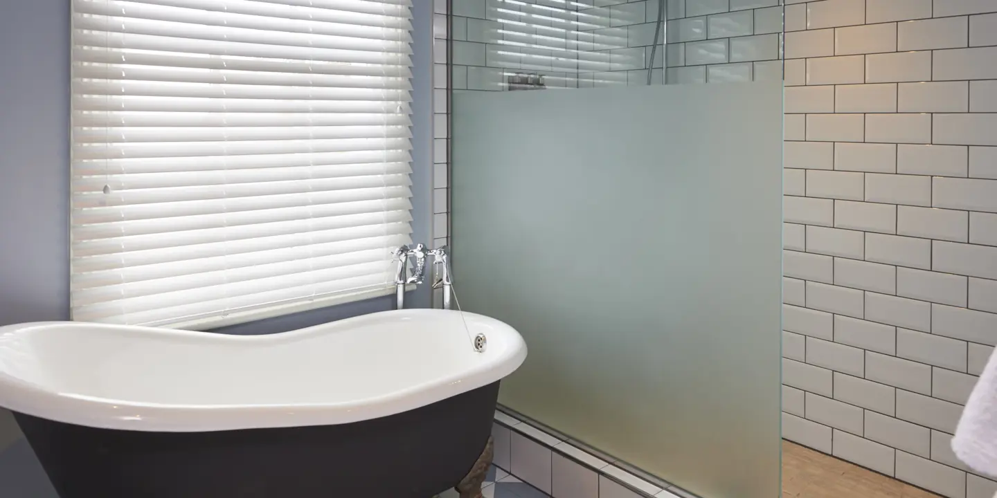 Bathroom featuring a bathtub and shower