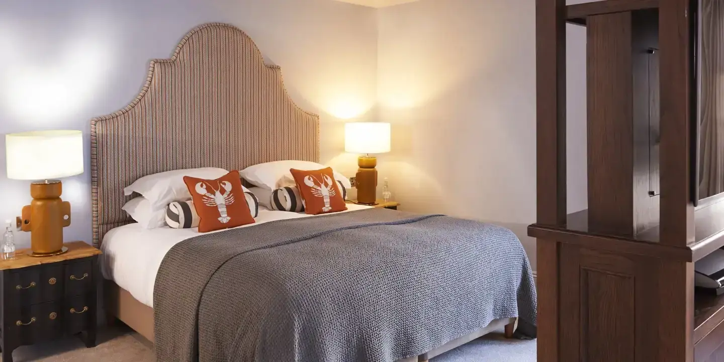 A bed positioned in a bedroom alongside a dresser.