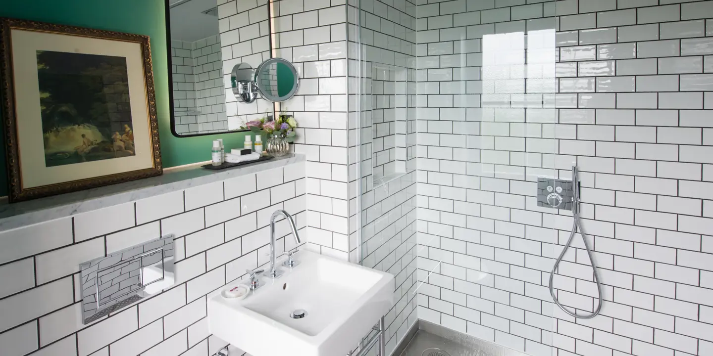 Bathroom featuring a sink and shower.