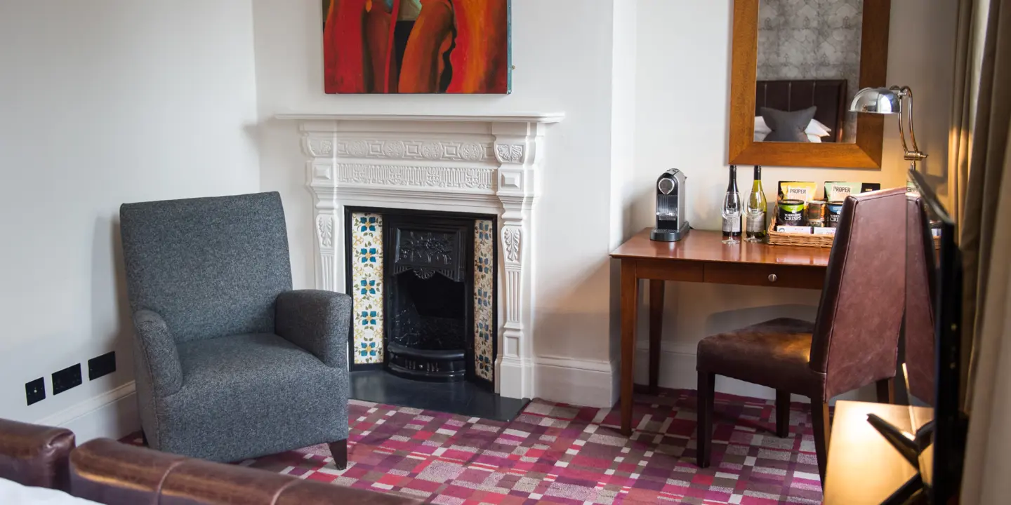 Living room featuring a fireplace and chair.