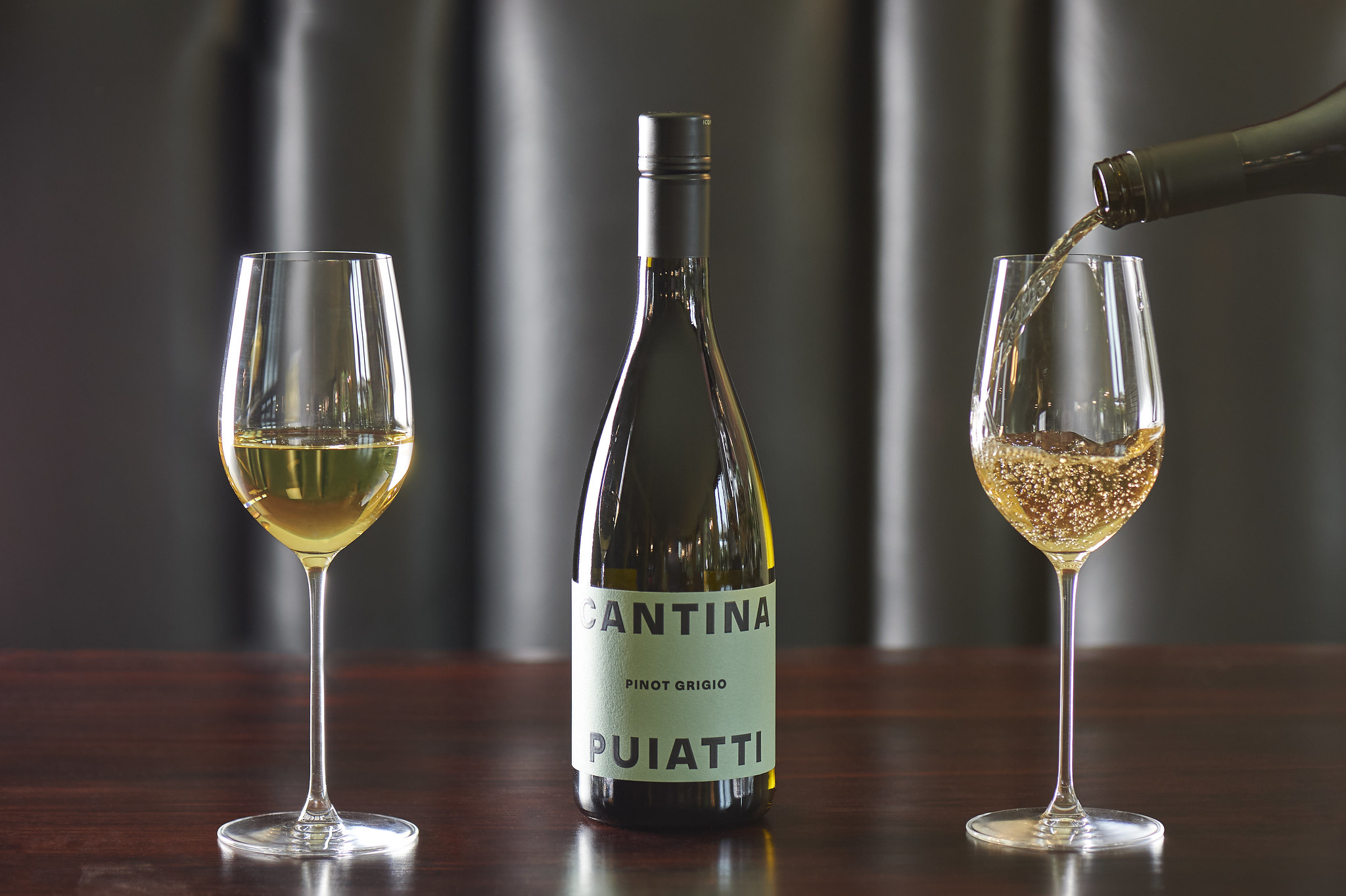 Pouring white wine into glass