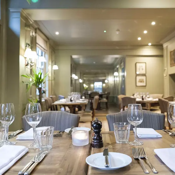 A table set with elegant place settings and cutlery.