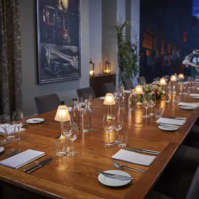 A beautifully arranged table adorned with sparkling wine glasses and elegant silverware.