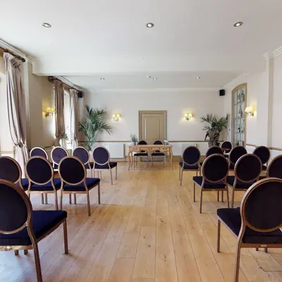 A room filled with numerous chairs and tables.