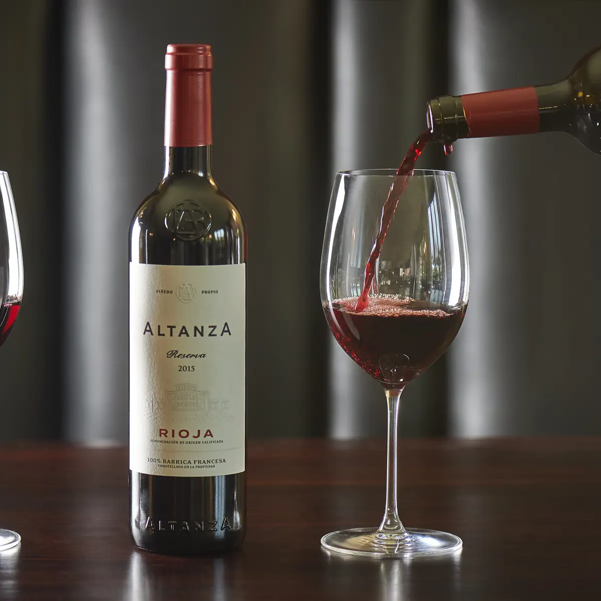 Red wine is poured into a glass