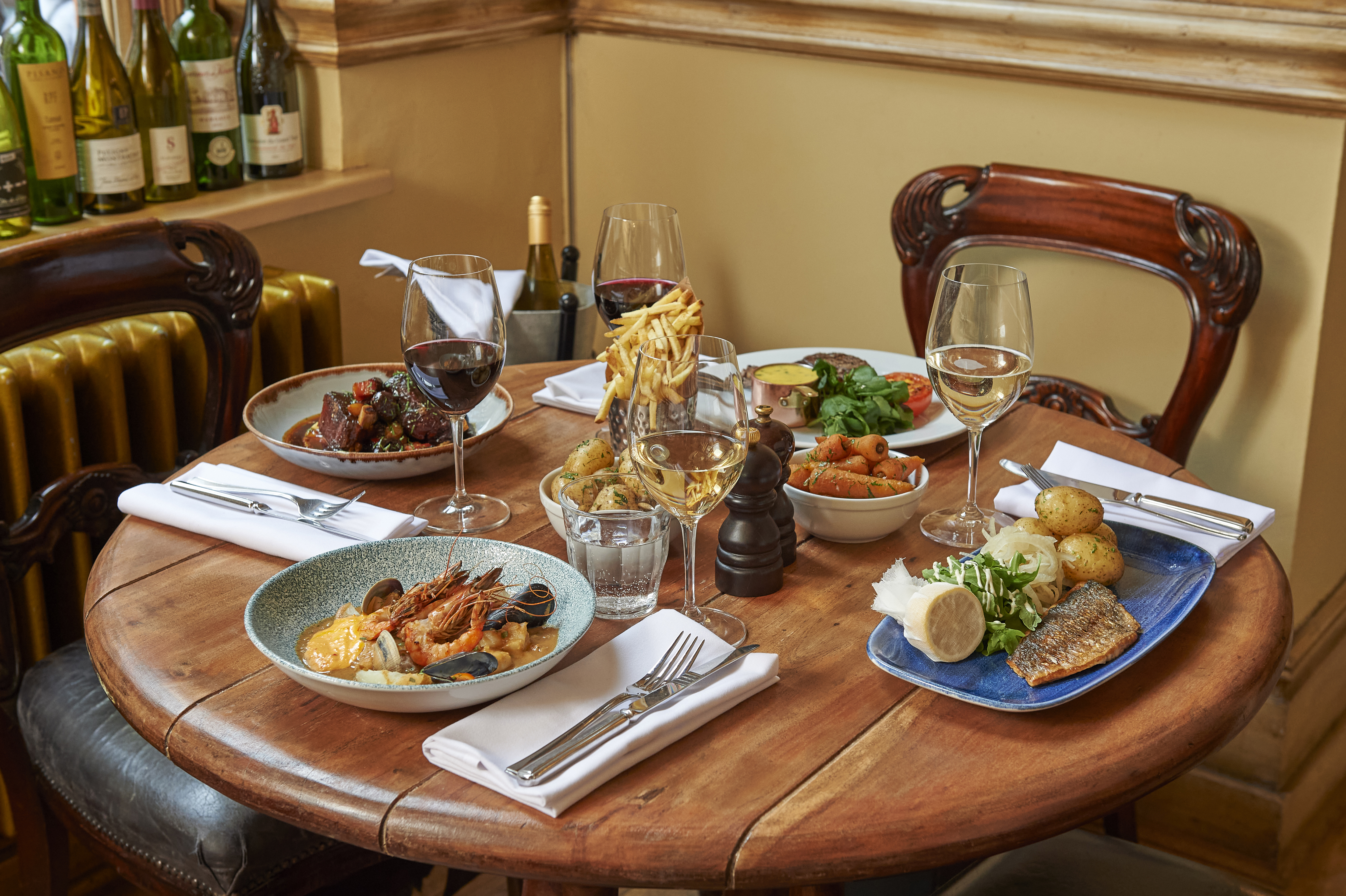 Four meals on a table at Hotel du Vin