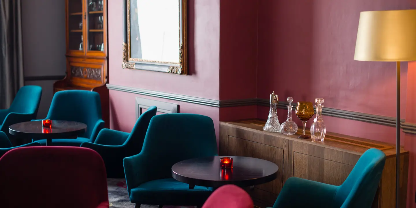 Chairs and tables arranged in a room.