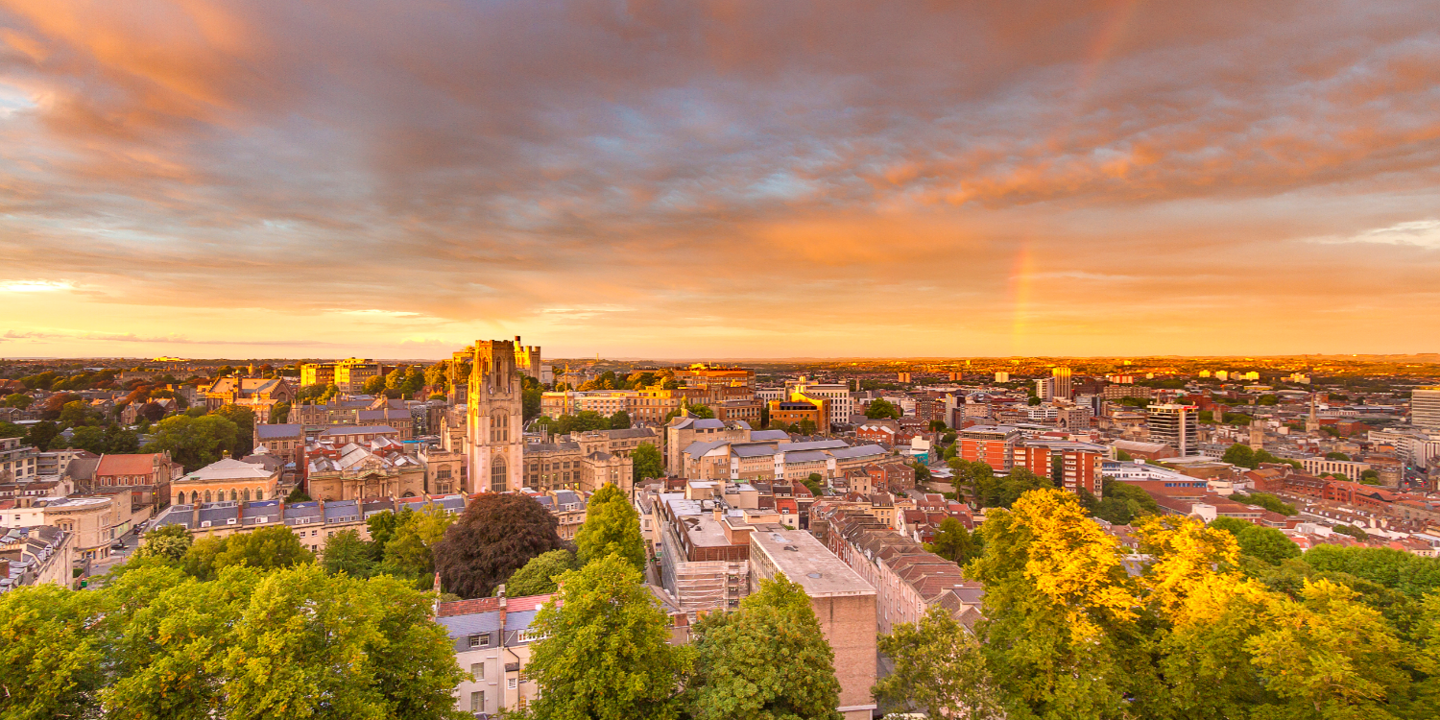 Aerial view of a city featuring a clock tower.
