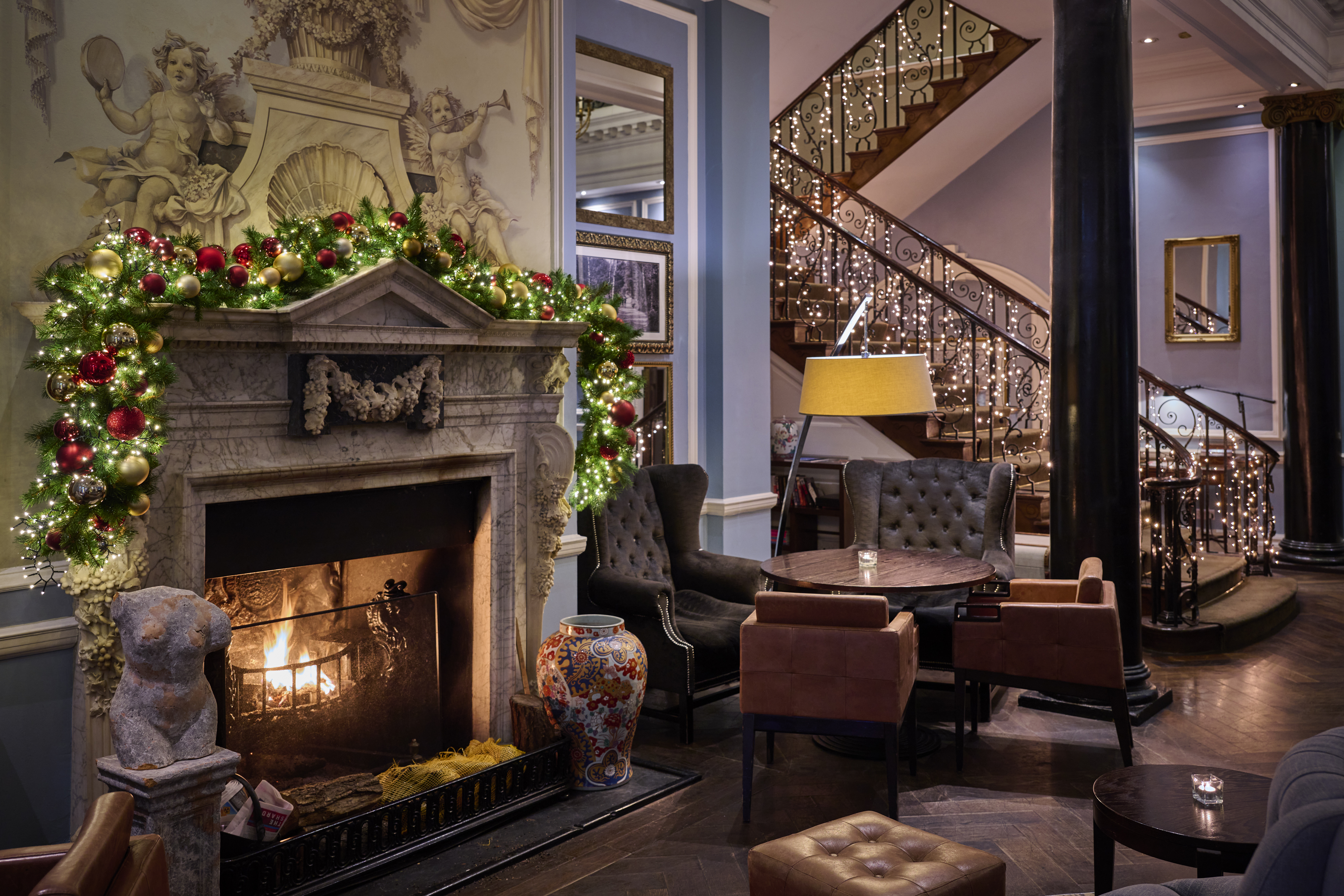 Festive ambience and decorations around a fireplace 