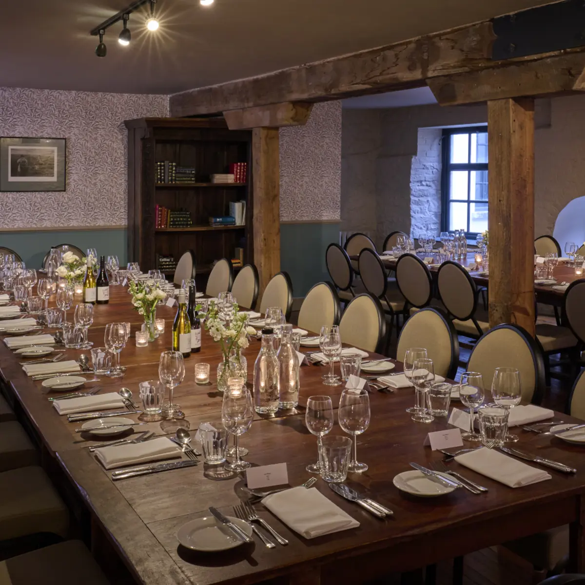 A beautifully arranged dining table with elegantly set place settings.