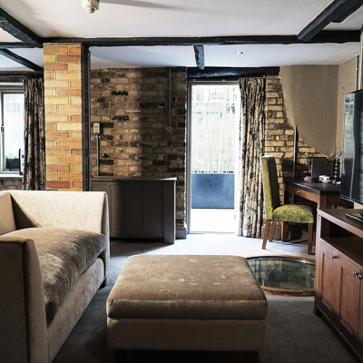 A well-furnished living room featuring a flat-screen TV.