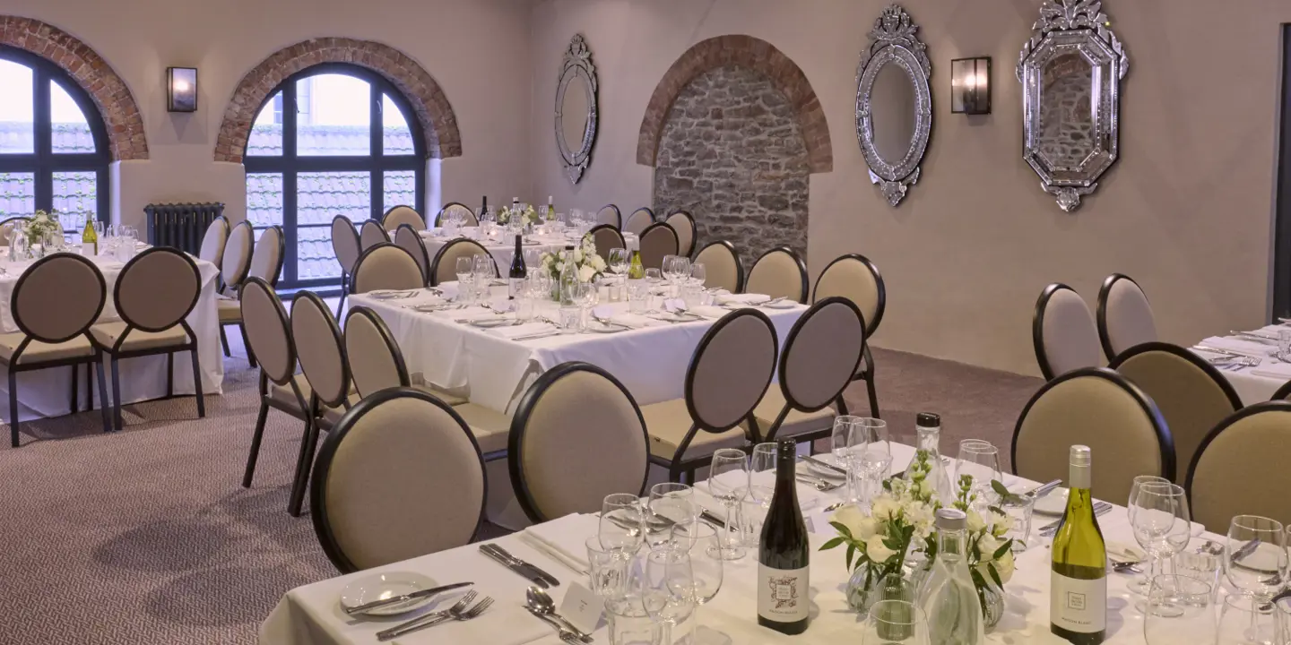 A beautifully arranged dining table with elegant place settings.