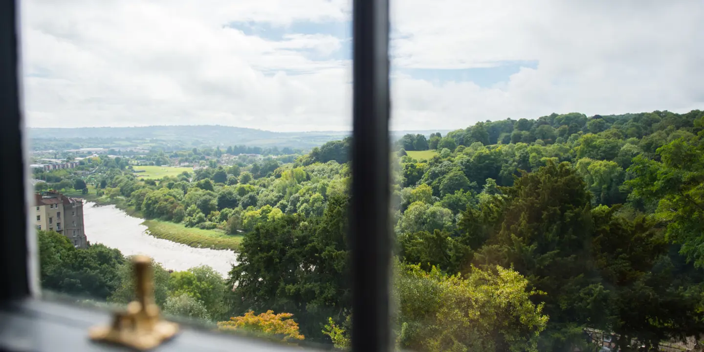 Scenic river view through a window.